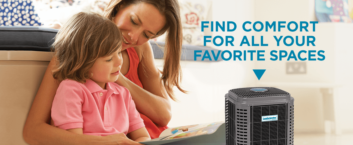 Mother and child reading book in heating and air conditioning home. Lakeway Air Comfortmaker.